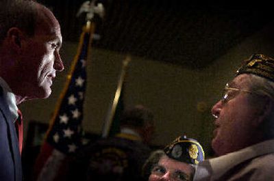 
Dennis Hession speaks with the Washington 9th District honor guard in City Hall on Monday moments after he resigned as City Council president. 
 (Jed Conklin / The Spokesman-Review)