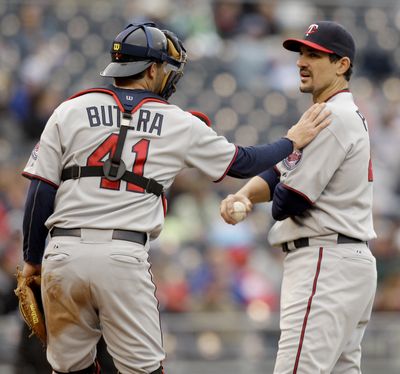 Minnesota Twins starting pitcher Carl Pavano had some batting practice with a garbage can in the Twins’ loss. (Associated Press)