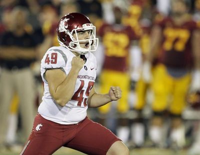 Washington State kicker Andrew Furney celebrates after kicking the winning field goal during the second half of an NCAA college football game against Southern California in Los Angeles, Saturday, Sept. 7, 2013. Washington State defeated Southern California 10-7 for its first victory at the Coliseum in 13 years. (Chris Carlson / Associated Press)