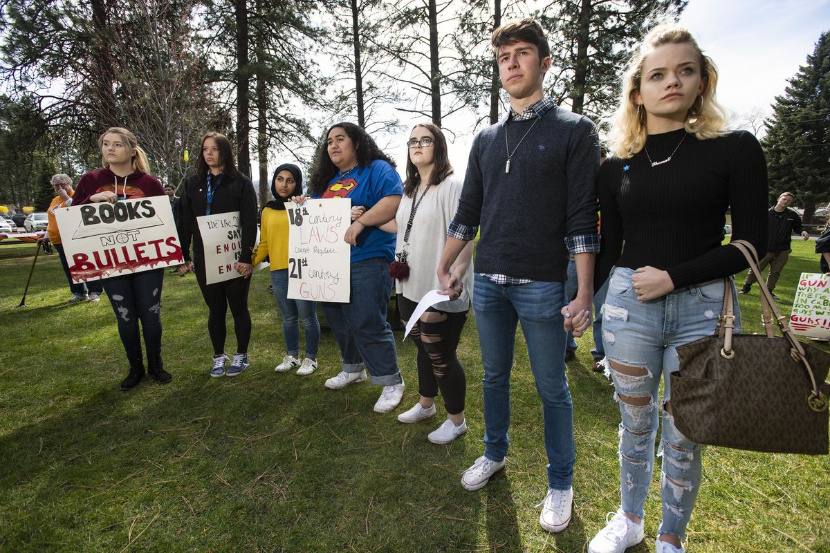 Students from Central Valley and University High Schools show their unity against school gun violence during a National School Walkout rally in Terrace View Park in the Spokane Valley, Friday, April 20, 2018. (Colin Mulvany / The Spokesman-Review)