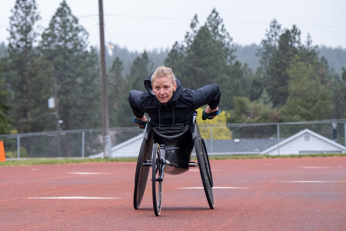 Tekoa native Susannah Scaroni pushes down the track during a practice session on Saturday, April 30, 2022, at Valley Christian School in Spokane Valley, Washington. Scaroni is the defending Bloomsday women’s wheelchair champion.  (Madison McCord/For The Spokesman-Review)