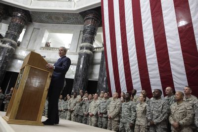 President George W. Bush speaks with U.S. troops Sunday at Camp Victory in Baghdad during a quick trip to Iraq and Afghanistan.  (Associated Press / The Spokesman-Review)