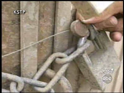 
What appears to be the seal of the U.N. International Atomic Energy Agency is seen on a lock on a bunker in the Al Qaqaa facility in Iraq is seen in this video footage made by Minneapolis ABC affiliate KSTP-TV on April 18, 2003, while the station had a crew embedded with the 101st Airborne Division. The station says the video shows soldiers examining explosives, but the station said it remained unclear if the explosives were the high-energy explosives that are missing.
 (Associated Press / The Spokesman-Review)