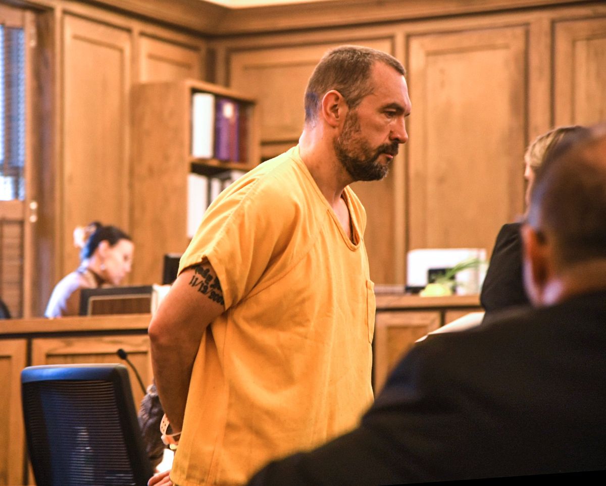Lee McNutt is marched out the courtroom after pleading guilty in court Wednesday, Oct. 12, 2022 in Spokane, Washington. McNutt was found hiding in a woman
