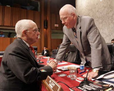
Senate Judiciary Committee Chairman Sen. Patrick Leahy, D-Vt., right, talks with Attorney General-designate Michael Mukasey on  Thursday after Mukasey's second day of testimony. Associated Press
 (Associated Press / The Spokesman-Review)