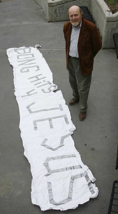 
Attorney Douglas Mertz shows the banner his student client held. Associated Press
 (Associated Press / The Spokesman-Review)