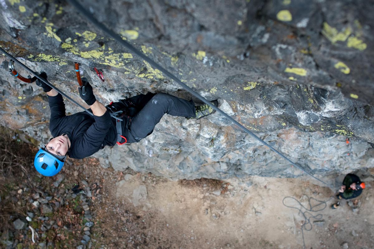 Kyle Breeding climbs at Lincoln Park on the South Hill on Tuesday Dec. 3, 2019 as Marlin Thorman belays. (Eli Francovich / The Spokesman-Review)
