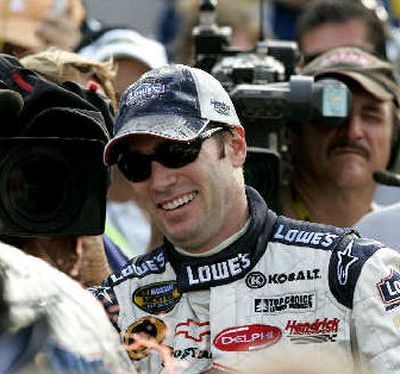 
Jimmie Johnson is all smiles in Victory Lane after winning the MBNA 400. 
 (Associated Press / The Spokesman-Review)