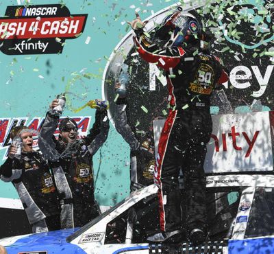 Tyler Reddick, right, celebrates in Victory Lane after winning a NASCAR Xfinity Series auto race at Talladega Superspeedway in Talladega, Ala., Saturday, April 27, 2019. (Julie Bennett / Associated Press)