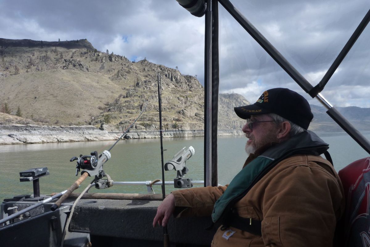 Dave Ross of Spokane trolls for trout on Lake Roosevelt. (Rich Landers)