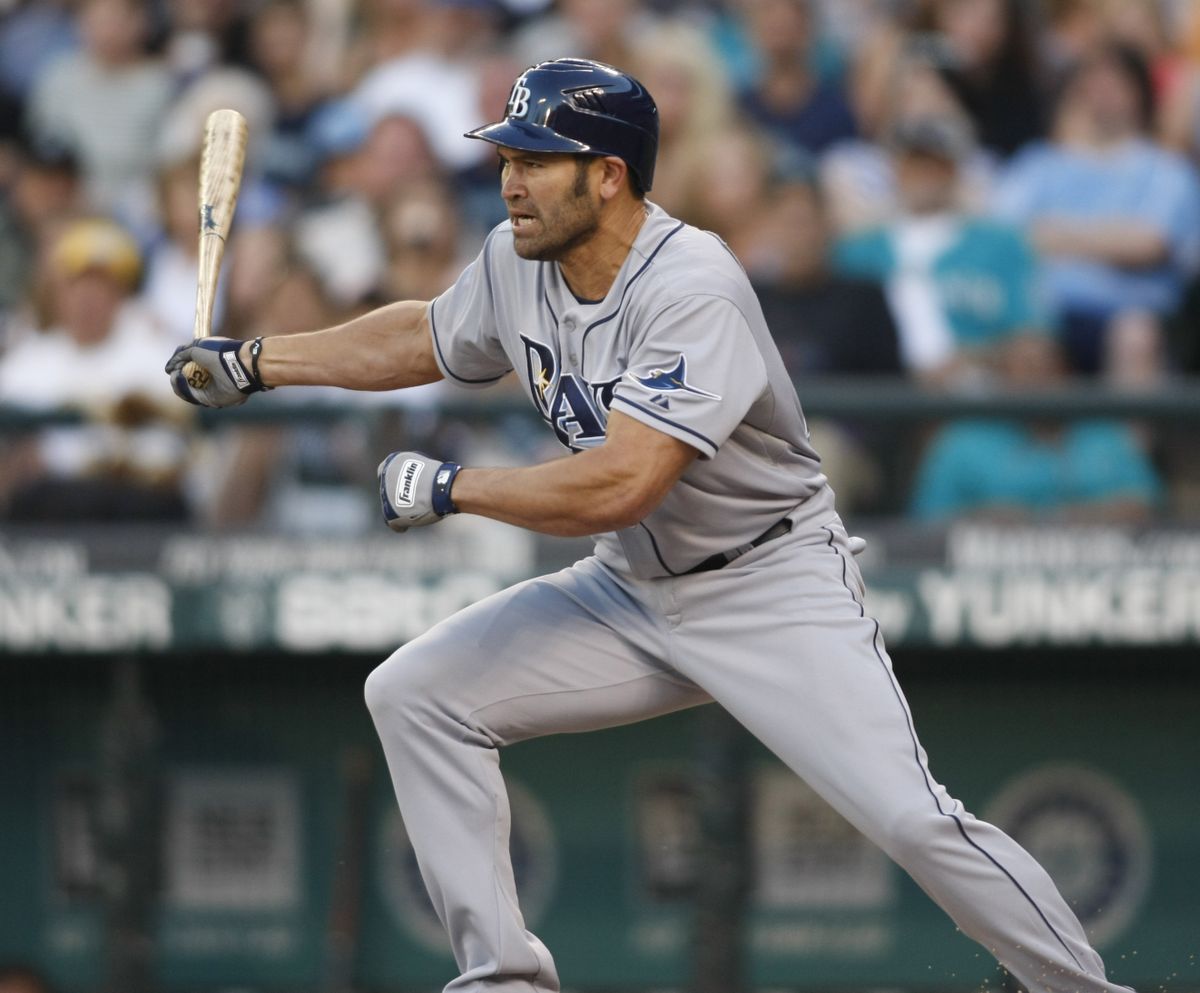 Tampa Bay Rays’ Johnny Damon hits a two-run RBI single against Seattle Mariners starter Erik Bedard during the second inning. (Associated Press)
