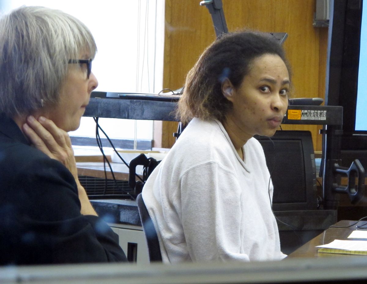 Annette Morales-Rodriguez, right, appears at her Milwaukee trial on Tuesday, Sept. 18, 2012, to face charges that she killed a pregnant woman and tried to steal her full-term fetus. Her defense attorney, Debra Patterson, left, told jurors the homicides weren