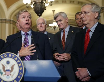 Sen. Lindsey Graham, R-S.C., speaks to the media, accompanied by Senate Majority Whip Sen. John Cornyn, R-Texas, Sen. Bill Cassidy, R-La., Sen. John Thune, R-S.D., and Senate Majority Leader Mitch McConnell of Ky., on Capitol Hill, Tuesday, Sept. 19, 2017, in Washington. (Alex Brandon / Associated Press)