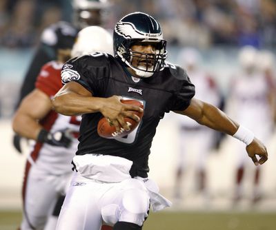 Donovan McNabb and the Eagles were off and running Thursday. McNabb threw four touchdown passes in a 48-20 victory.  (Associated Press / The Spokesman-Review)