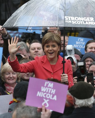 Scottish National Party leader Nicola Sturgeon waves to party activists Wednesday in Edinburgh, Scotland. (Associated Press)