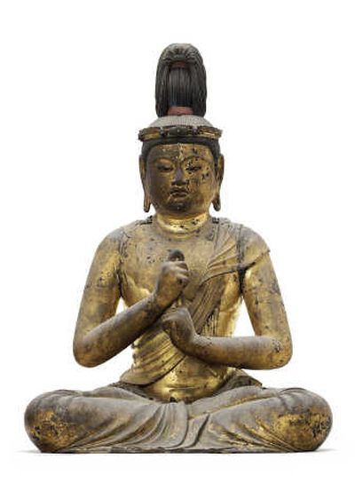 
This undated photo supplied by Christie's auction house shows a sculpture of the seated figure of Dainichi Nyorai, or the supreme Buddha.  The newly discovered wooden sculpture that had religious objects sealed in its torso for 800 years sold for $14.3 million at auction Tuesday. Associated Press
 (Associated Press / The Spokesman-Review)