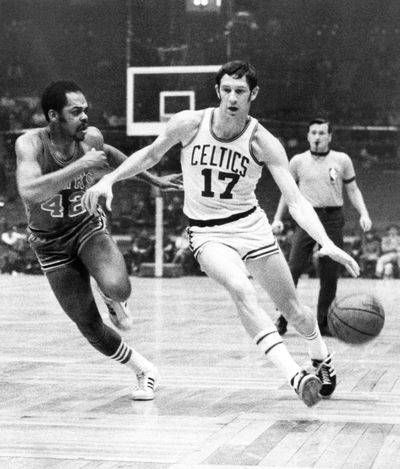 In this Jan. 8, 1970  photo, Boston Celtics’ John Havlicek (17) protects ball with his body from Atlanta Hawks’ Walt Hazzard (42) during an NBA basketball game in Boston. The Boston Celtics say Hall of Famer John Havlicek, whose steal of Hal Green’s inbounds pass in the final seconds of the 1965 Eastern Conference finals against the Philadelphia 76ers remains one of the most famous plays in NBA history, has died. The team says Havlicek died Thursday, April 25, 2019 at age 79. (Associated Press)