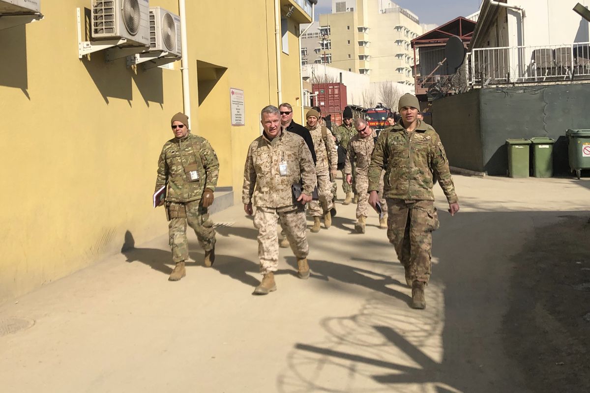 Marine Gen. Frank McKenzie, center, top U.S. commander for the Middle East, makes an unannounced visit in Kabul, Afghanistan in this photo from January 2020. President Joe Biden announced a Sept. 11 deadline for completing the withdrawal of U.S. troops from Afghanistan.  (Lolita Baldor)