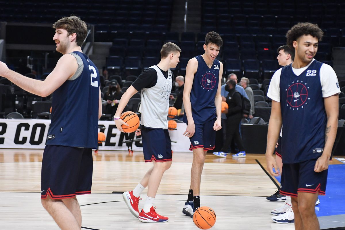 Gonzaga Bulldogs center Chet Holmgren (34) smiles with teamates forward Drew Timme (2) forward Anton Watson (22) and forward Ben Gregg (33) during a practice before the Bulldogs’ Sweet 16 matchup against the Arkansas Razorbacks on Wednesday Mar 23, 2022, at Chase Center in San Francisco, Calif.  (Tyler Tjomsland/The Spokesman-Review)