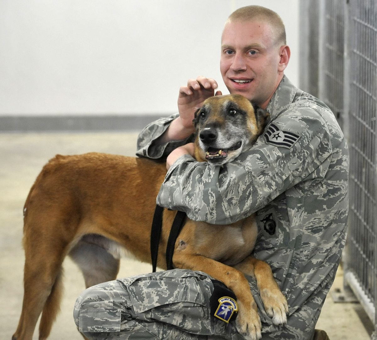 Leaving Friday, Jan. 14, 2011, U.S. Air Force Staff Sgt. Chris Fall will be taking military dog, Lucky, from Fairchild Air Force Base to be deployed in Kyrgyzstan.  Lucky has survived cancer and will work his last tour of duty at the Manas Transit Station. (Dan Pelle / The Spokesman-Review)