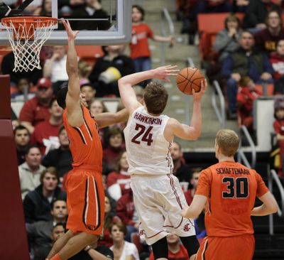 Washington State forward Josh Hawkinson, who had 11 points and nine rebounds for the Cougars on Saturday, draws a foul on Oregon State's Malcolm Duvivier. (AP)