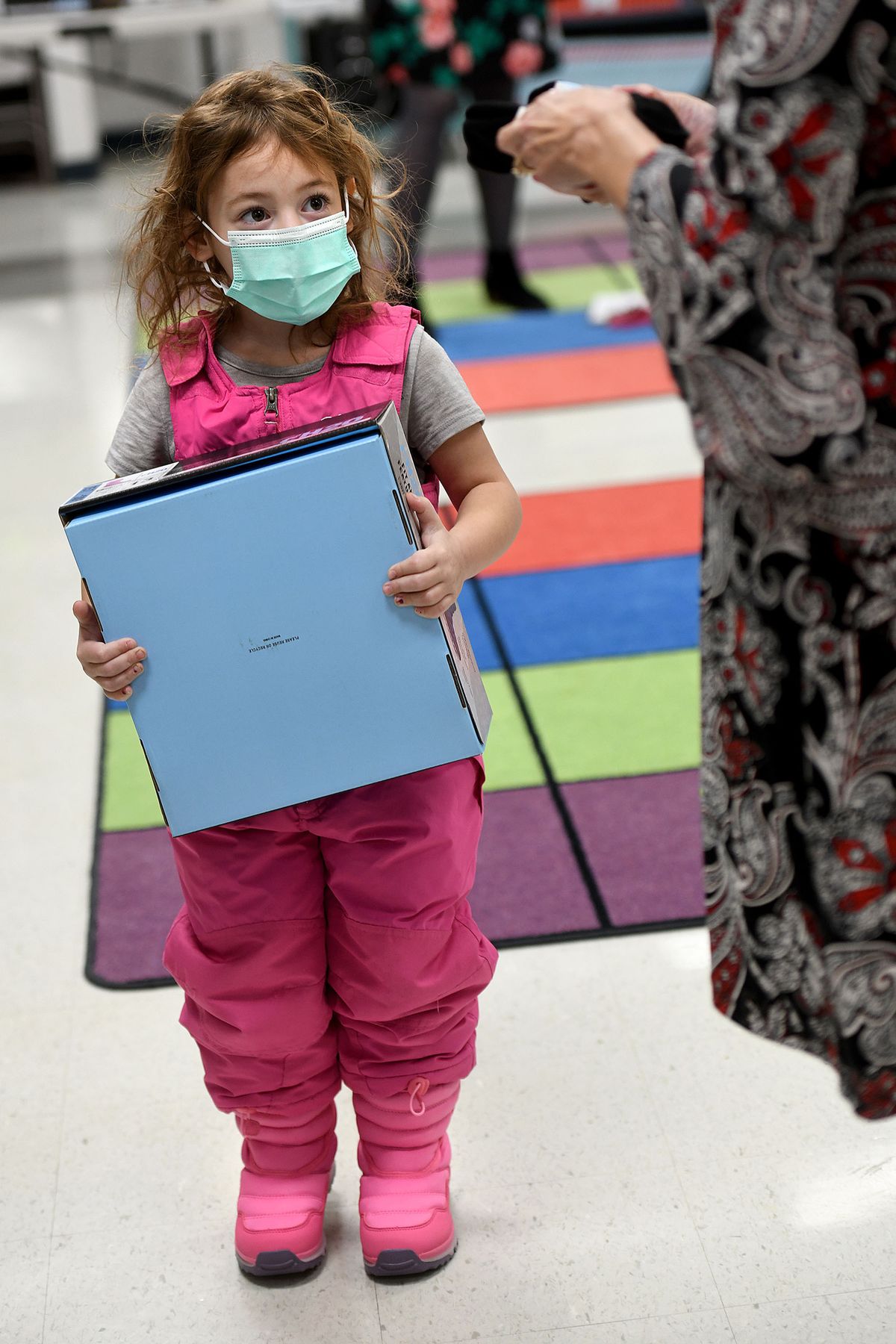 Kindergartner Abigail Pollay wears her new pink boots Monday during the “Give Cold Feet The Boot” event at Idaho Hill Elementary in Oldtown, Idaho.  (Kathy Plonka/The Spokesman-Review)