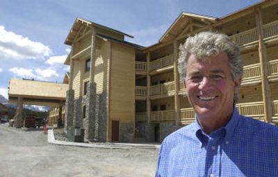 
Owner Roscoe Black stands outside the St. Mary Lodge in this 2001 photo. The lodge that stands next to Glacier National Park, and once hosted actor Ronald Reagan, is for sale along with 40 acres of land that could be developed. 
 (AP / The Spokesman-Review)