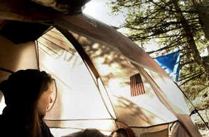 
Tiffany, a 20-year-old homeless woman, left, and her boyfriend rest early Thursday morning in their tent in the Dishman Hills Natural Area. Police found several similar camps in the hills this month.
 (Brian Plonka / The Spokesman-Review)