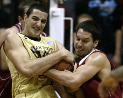 
San Diego State's Chris Lamb, left, and Washington State's Derrick Low fight for the ball. 
 (Associated Press / The Spokesman-Review)