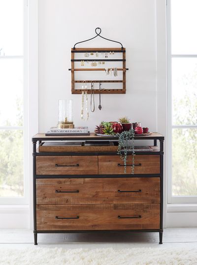 Show off your earrings and necklaces, even when you’re not wearing them, with a space-saving, wall-mounted hanger, like Pottery Barn’s pine and iron wall-mounted jewelry hanger, $99. (Pottery Barn / Pottery Barn)