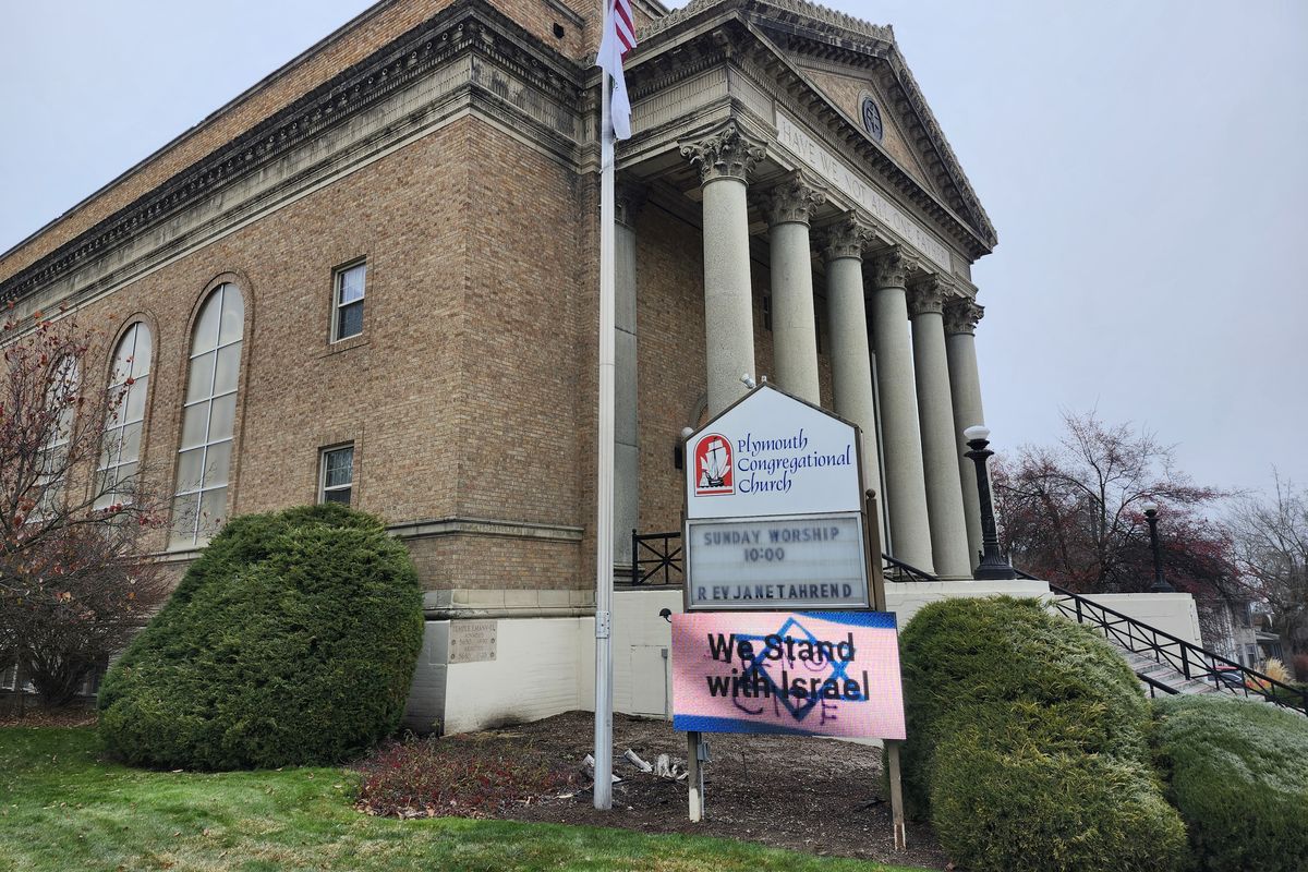 A pro-Israel sign was defaced at Plymouth Congregational Church on Sunday in Spokane.  (Amanda Sullender / The Spokesman-Review)