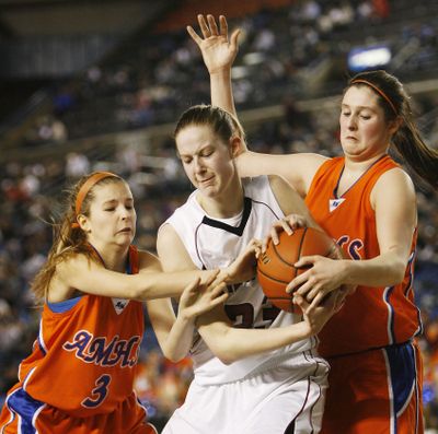 North Central's Tara VanWeerdhuizen, middle, battles for a rebound with Auburn Mountainview's Aly Carr, left, and Caitlin Carr, right, during the Indians’ victory. (Patrick Hagerty)
