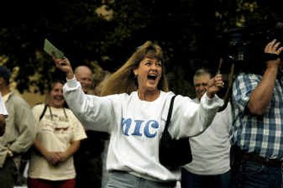 Idaho College, runs joyfully to the stage after it was announced she was the winner of the $20,000 first prize in the Really BIG Raffle on Wednesday evening at NIC. The grand prize, a new home, went to Duane Harvey of Spokane, who was not present.
(Jesse Tinsley / The Spokesman-Review)