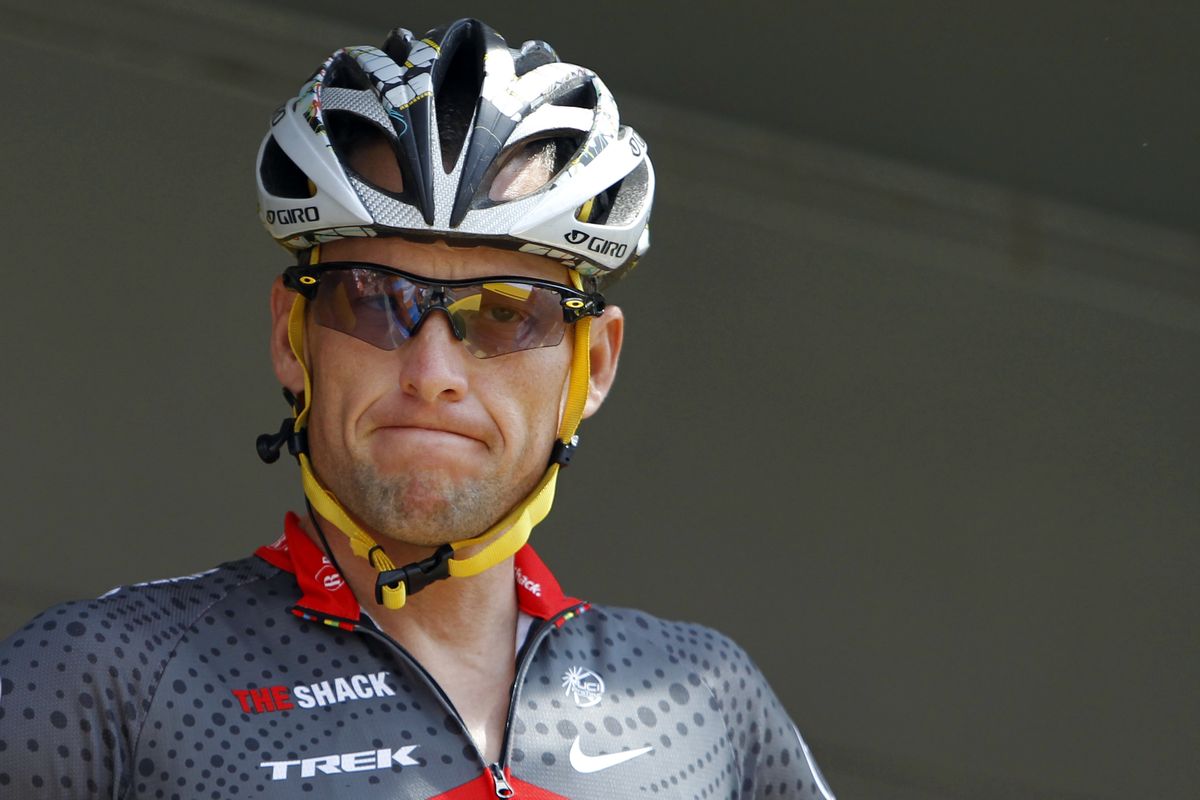 FILE - In this July 6, 2010, file photo, Lance Armstrong grimaces prior to the start of the third stage of the Tour de France cycling race in Wanze, Belgium. Armstrong said on Thursday, Aug. 23, 2012, that he is finished fighting charges from the United States Anti-Doping Agency that he used performance-enhancing drugs during his unprecedented cycling career, a decision that could put his string of seven Tour de France titles in jeopardy. (Christophe Ena / Associated Press)