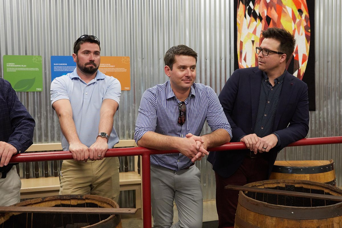 Jake Hill, center, general manager of Whispers Lounge at Coeur d’Alene Resort, visits Maker’s Mark Distillery in Louisville, Kentucky, in May. (Coeur d’Alene Resort)