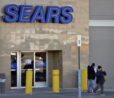 People leave a Sears store in Brooklyn’s Flatbush neighborhood in New York. Once a monolith of American retail, the company says there is “substantial doubt” it will be able to keep its doors open. (Bebeto Matthews / Associated Press)