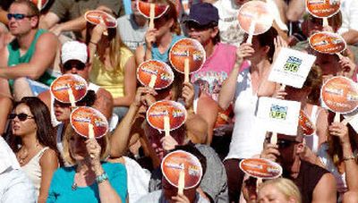 
Fans at center court  try to shade off sun and temperatures nearing 100 degrees. 
 (Joe Barrentine / The Spokesman-Review)