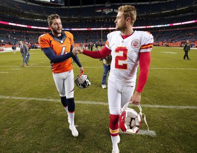 Denver Broncos punter Britton Colquitt, left, shakes hands with his brother Kansas City Chiefs punter Dustin Colquitt following an NFL game in Denver. (Jack Dempsey / Associated Press)