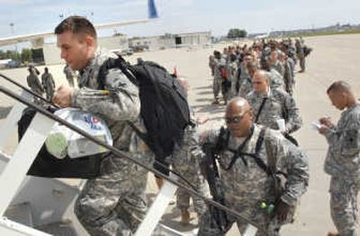
Members of the Illinois National Guard board jets in Bloomington, Ill., on Tuesday, bound for Fort Bragg, N.C., where they will train for two months before deploying to Afghanistan.Associated Press
 (Associated Press / The Spokesman-Review)