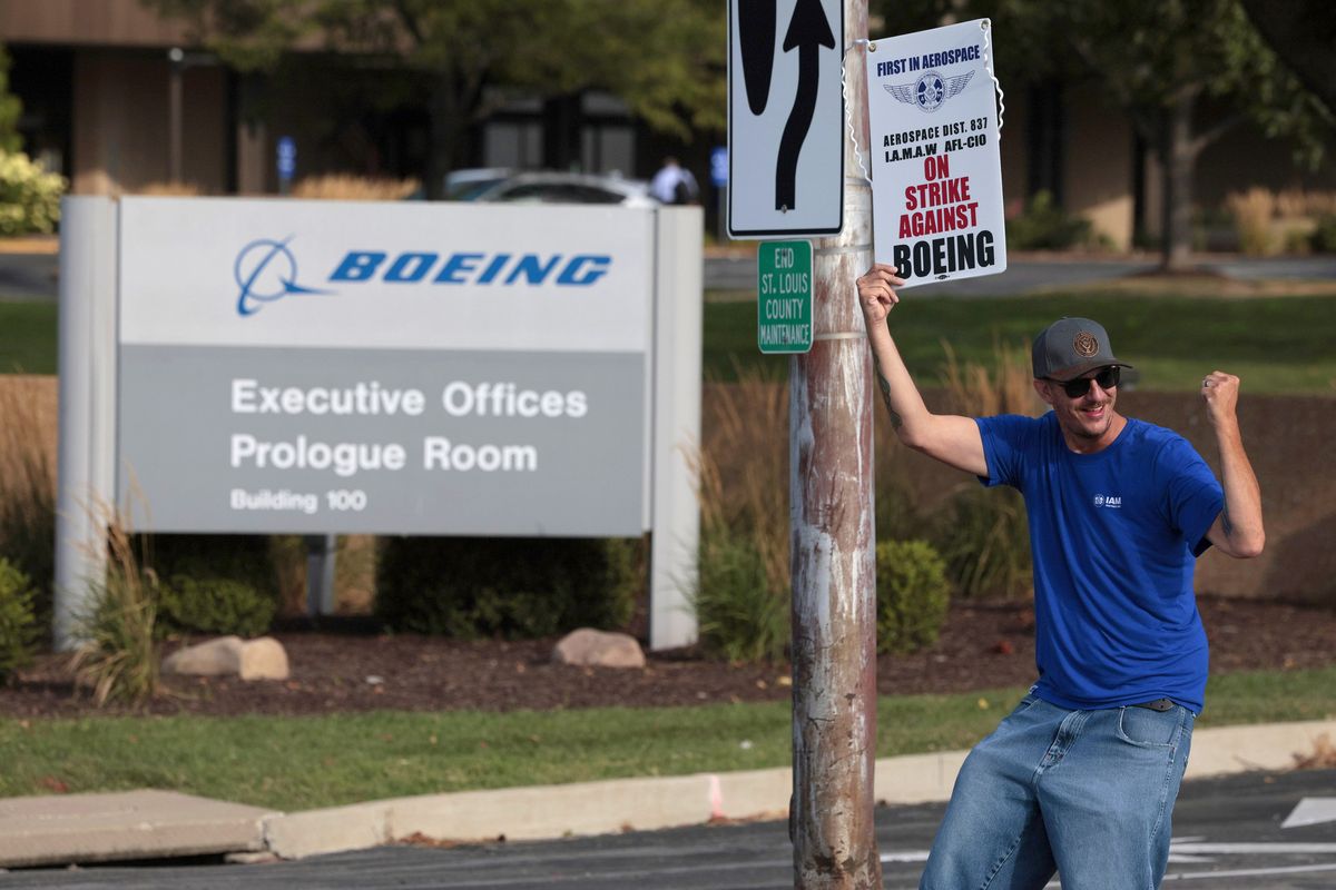 Justin Winters, an aerospace worker with the IAMAW (International Association of Machinists and Aerospace Workers) Dist. 837 pickets outside Boeing’s Berkeley, Missouri headquarters building on Monday, Aug. 4, 2025, after employees voted down a contract with the defense contractor on Sunday and started striking.  (Christian Gooden/St. Louis Post-Dispatch/TNS)