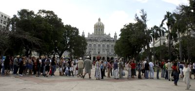 Residents line up outside the Spanish Embassy in Havana on Monday to apply for citizenship.  (Associated Press / The Spokesman-Review)