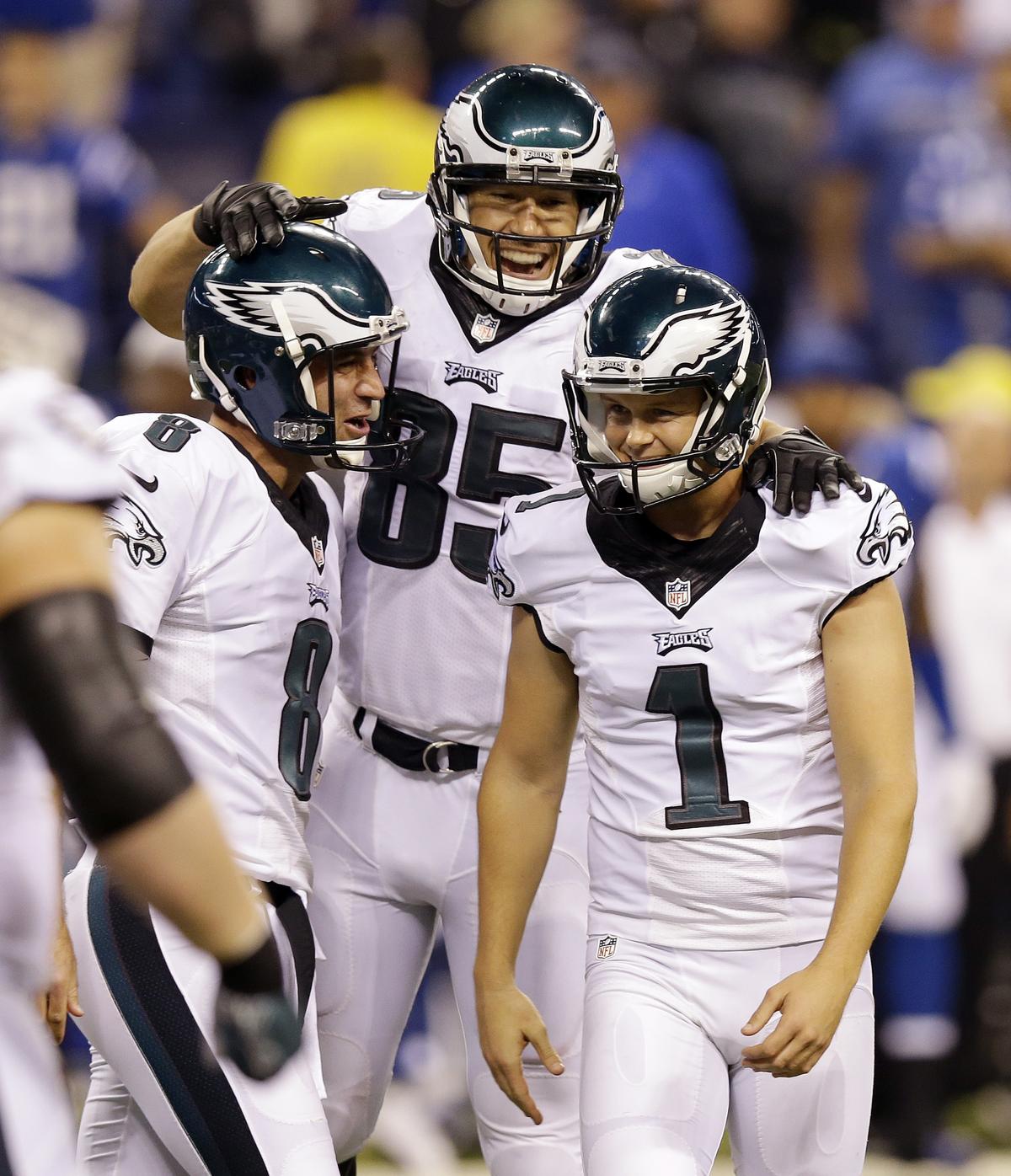Donnie Jones, left, and James Casey (85) congratulate Cody Parkey on game-winning field goal. (Associated Press)