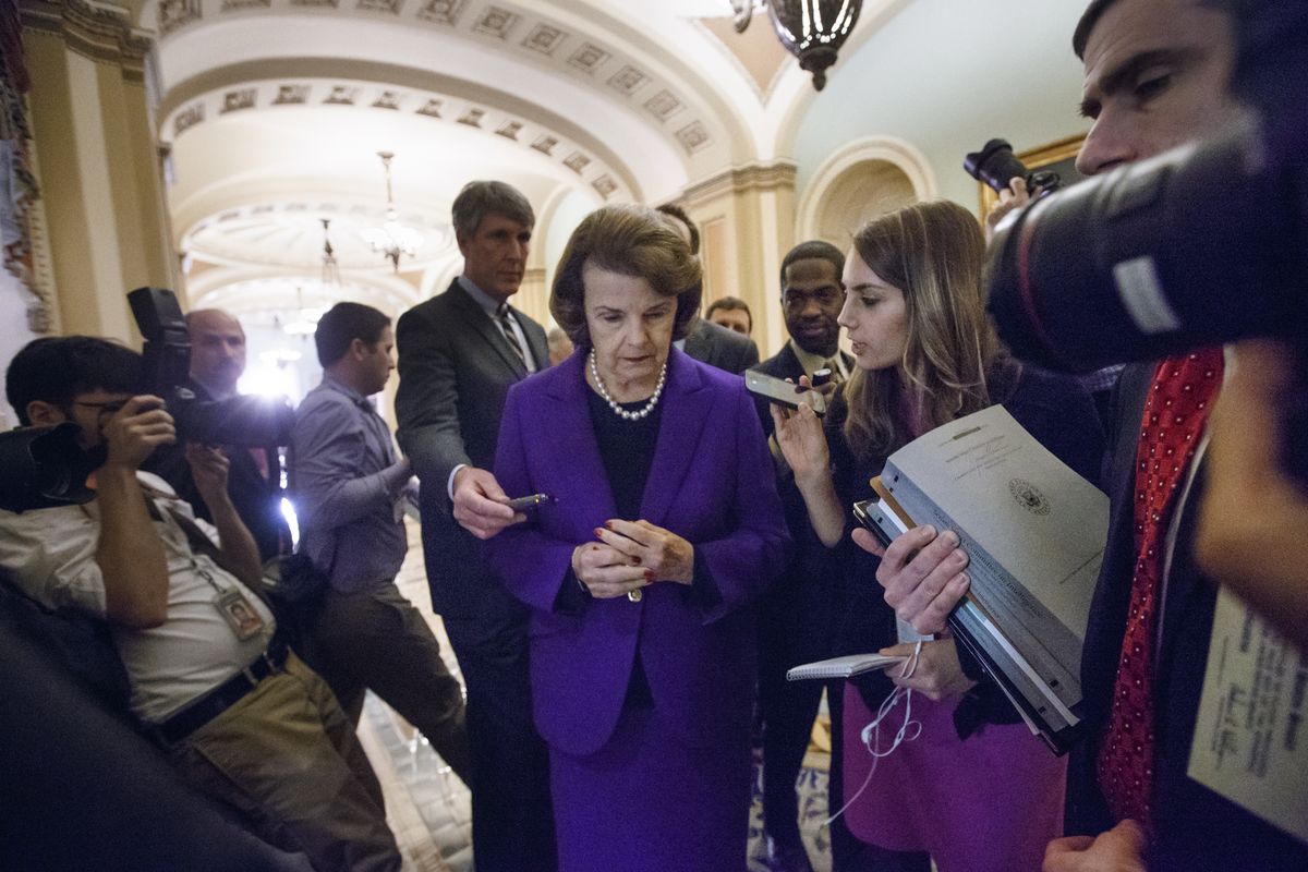 Reporters surround Senate Intelligence Committee Chair Sen. Dianne Feinstein, D-Calif., after she released the report. (Associated Press)