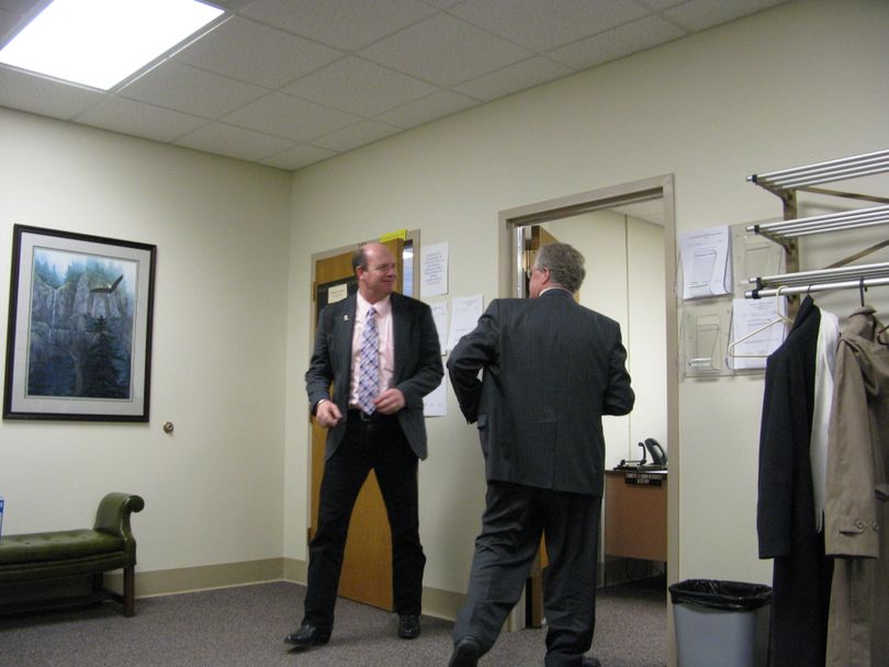 House Majority Leader Mike Moyle, R-Star, confers with House Minority Leader John Rusche, D-Lewiston, during a closed-door GOP caucus Thursday, after Rusche knocked on the door to check in. Moyle told Rusche the Republicans planned to keep going a while, and the House wouldn't reconvene until 1:30, freeing Democrats to go to lunch. (Betsy Russell / The Spokesman-Review)
