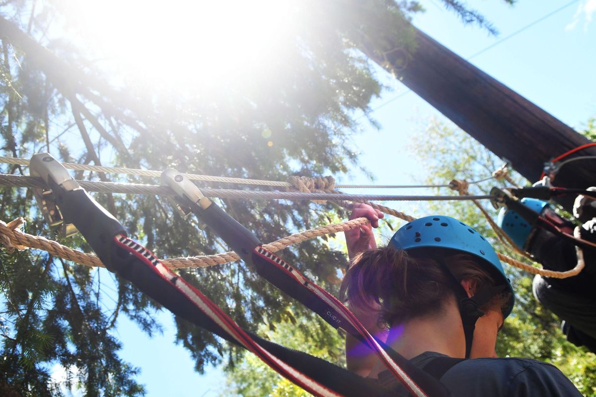 Jack Martin, 17, goes through the practice drill at Mica Moon Treetop Adventures in Liberty Lake on Monday, July 2, 2018. (Kathy Plonka / The Spokesman-Review)