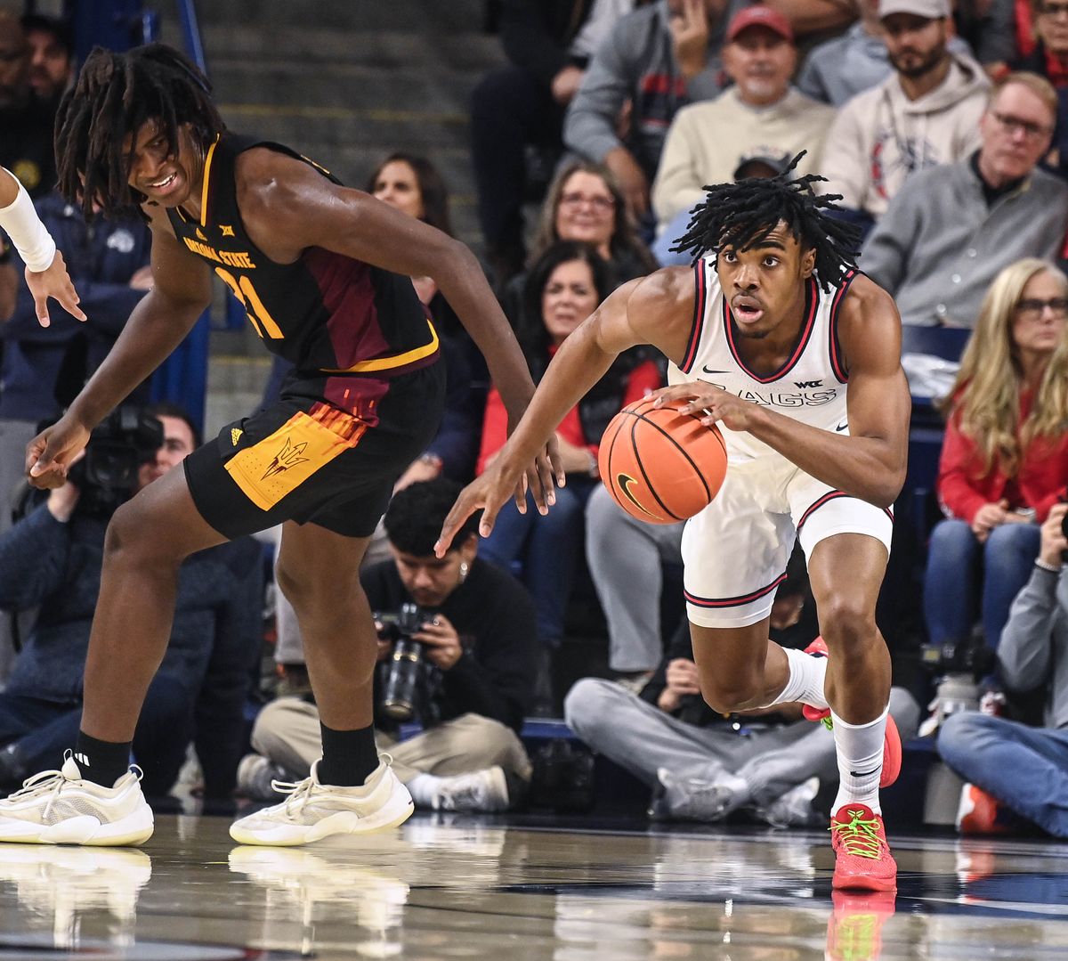 After forcing the turnover from Arizona State forward Jayden Quaintance, left, Gonzaga guard Michael Ajayi heads downcourt Sunday during the first half of an NCAA college basketball game at the McCarthey Athletic Center.  (COLIN MULVANY)