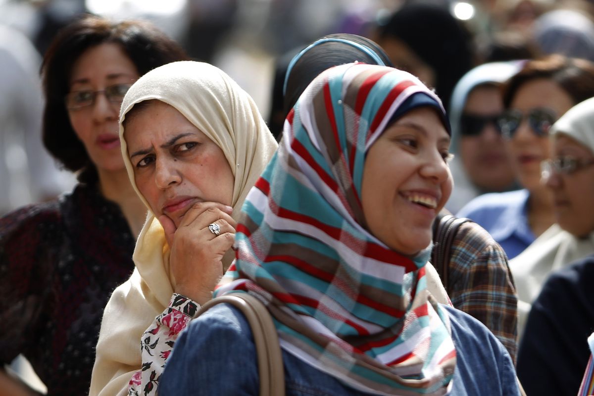 Egyptian women wait to vote at Ibn Nafis Language School polling station in Nasr City, a district in Cairo, on Wednesday. (Associated Press)