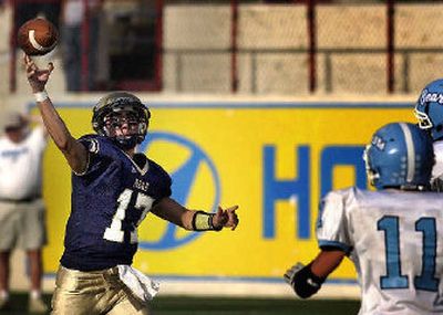 
Mead QB Andrew DeFelice tests Central Valley's defense Thursday at Albi Stadium. 
 (Jed Conklin / The Spokesman-Review)