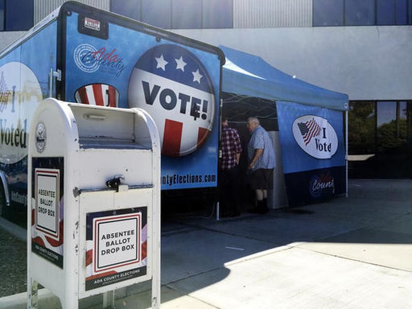 Idaho voters head to a new food truck-inspired voting unit in Boise, Idaho on Tuesday, Sept. 27, 2016. The four new trailers will be parked throughout the state's most populated county in the three weeks leading up to the November election and allow Idahoans to vote early without going to their designated precinct. (AP / Kimberlee Kruesi)