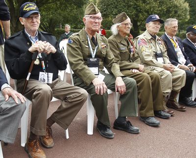 World War II U.S. veterans attend a ceremony held at the Memorial of the Colleville American military cemetery, in Colleville-sur-Mer, France on Thursday. From left: Melbert Hillert, 91, from Frisco, Texas; Earl Tweed, 91, from Dallas; Robert Blatnik, 93, from Raleigh, Texas; Robert Bearden, 90, from Belton, Texas; and Joseph J. Turecky, 91, from Dallas. (Associated Press)